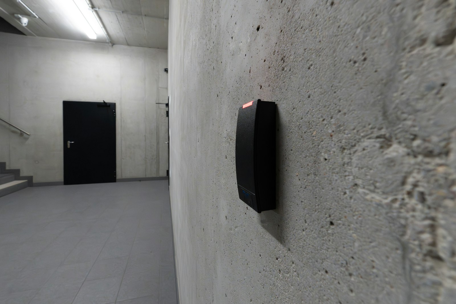 Wall-mounted access control card reader at a secure door