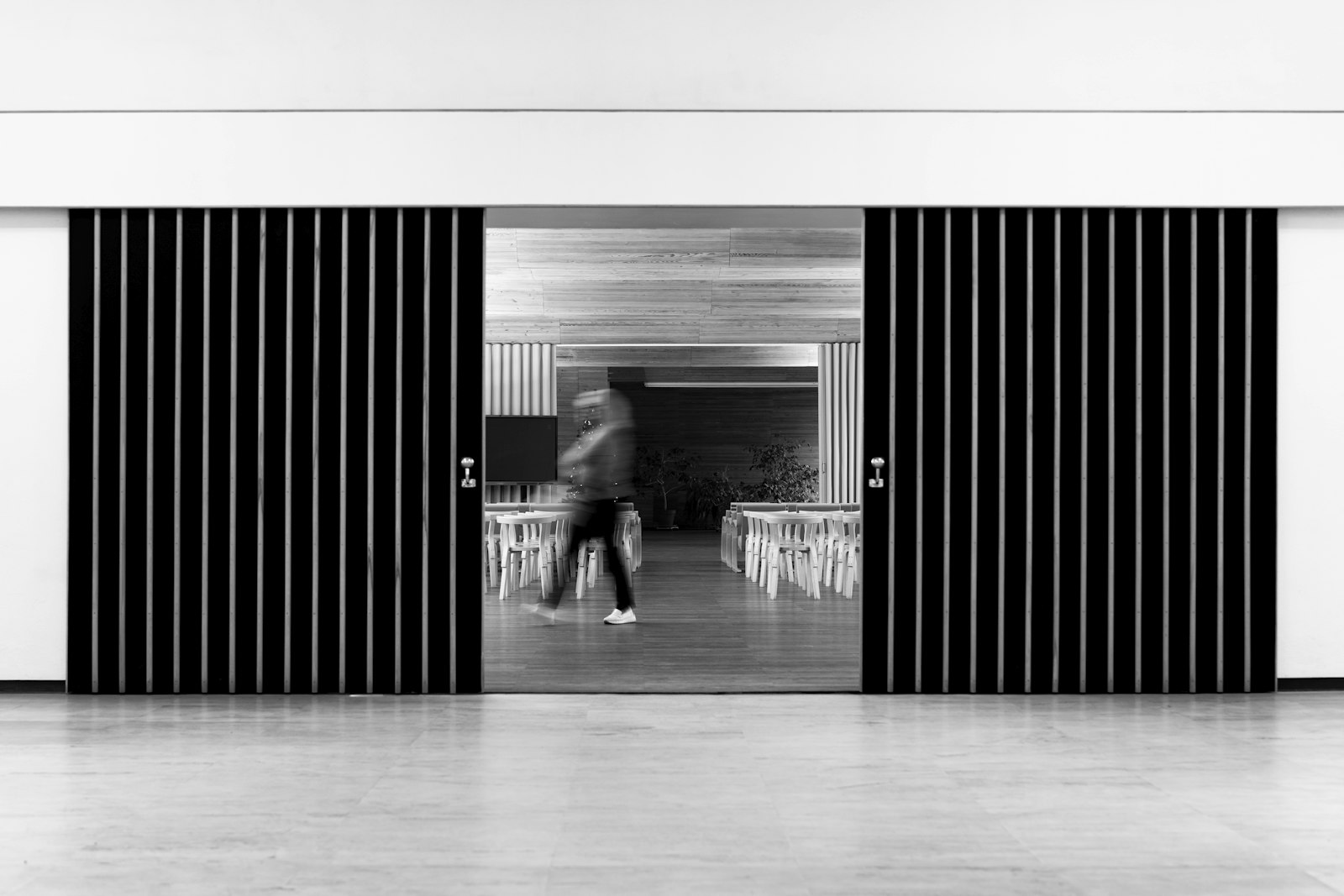 Modern automatic glass sliding doors at a commercial entrance